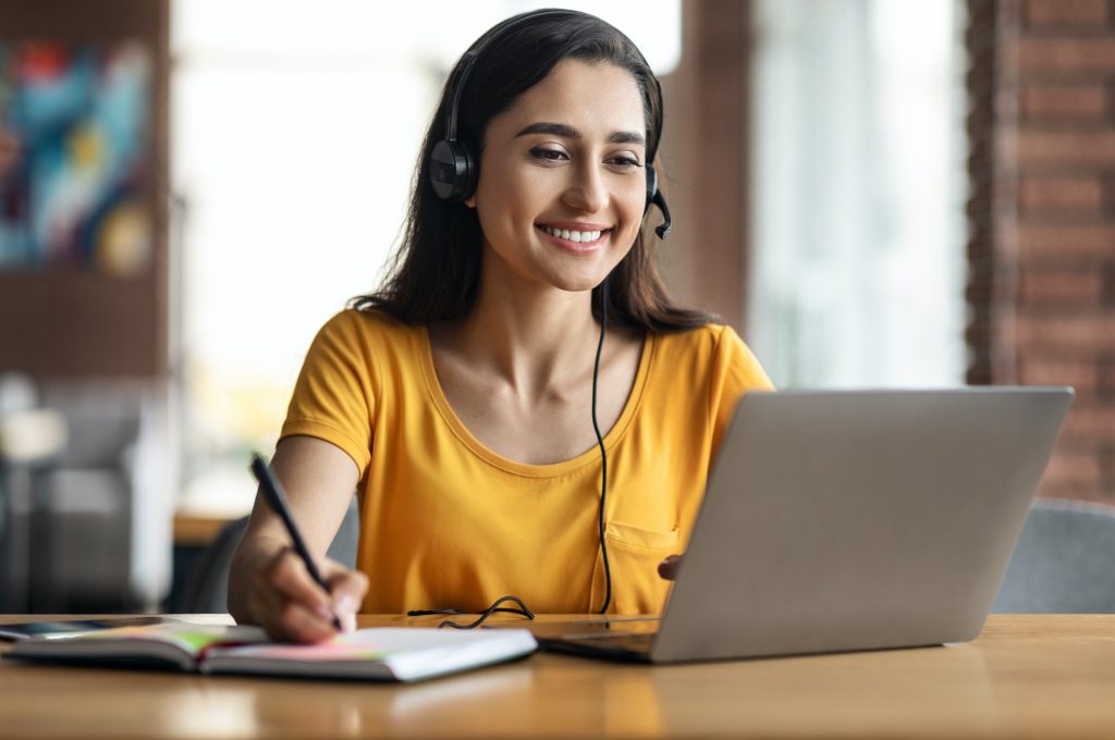 happy-young-arab-woman-having-educational-course-online